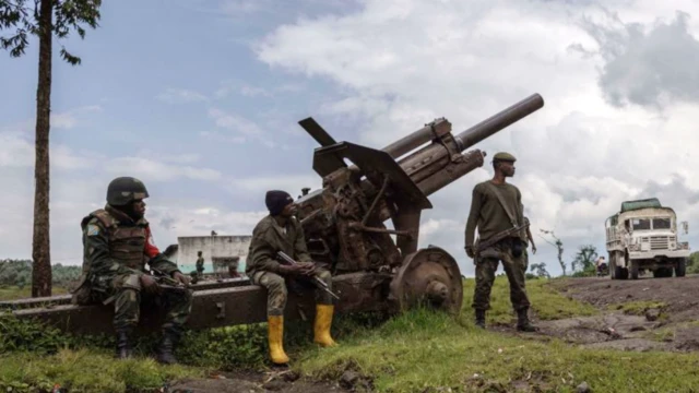 Congolese army soldiers patrol National Road 2 in Kibumba, DR Congo