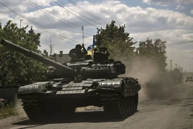 Ukrainian troops move towards the front line in the eastern Ukrainian region of Donbas