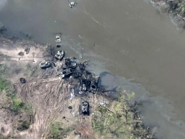 Remnants of Russian tanks destroyed along a dirt track by the Siverskyi Donets River