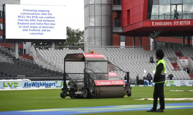 A big screen at Old Trafford announcing the fifth Test's cancellation