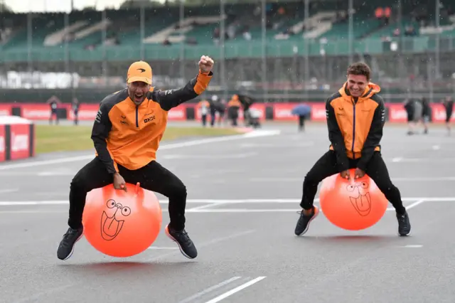 Daniel Ricciardo and Lando Norris on space hoppers