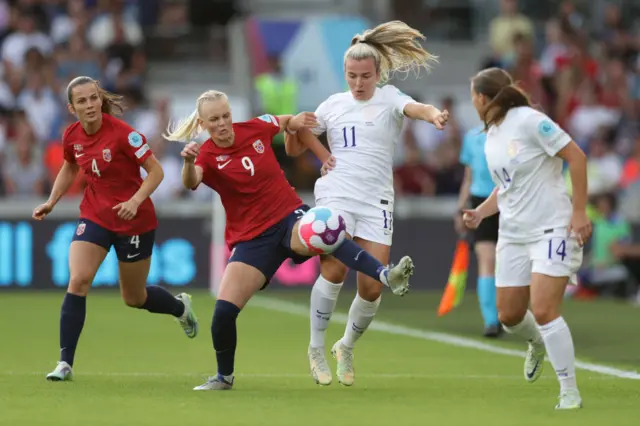 Lauren Hemp of England battles for possession with Karina Saevik