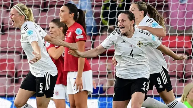 Julie Nelson and Sarah McFadden celebrate that historic goal