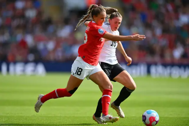 Julia Hickelsberger-Fuller of Austria battles for possession with Rebecca Holloway of Northern Ireland