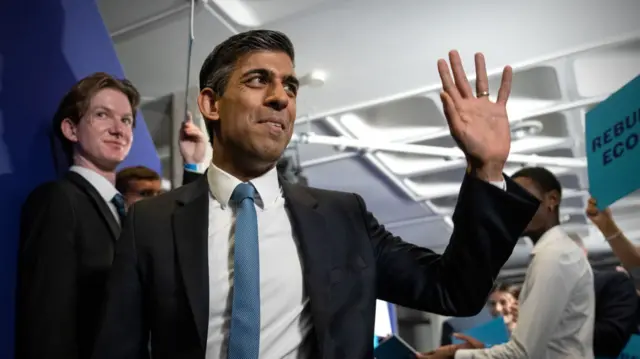 Rishi Sunak waves to supporters as he announces his leadership bid