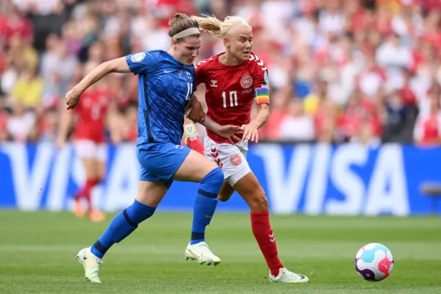 Natalia Kuikka of Finland is challenged by Pernille Harder