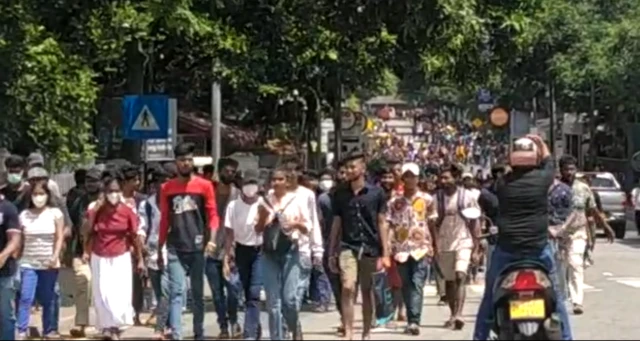 Crowds of protesters moving to Flower Road