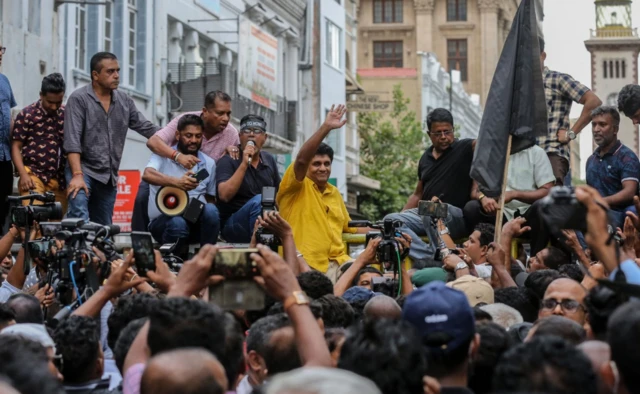 Sajith Premadasa (in yellow) leading an opposition rally against the Rajapaksas last month