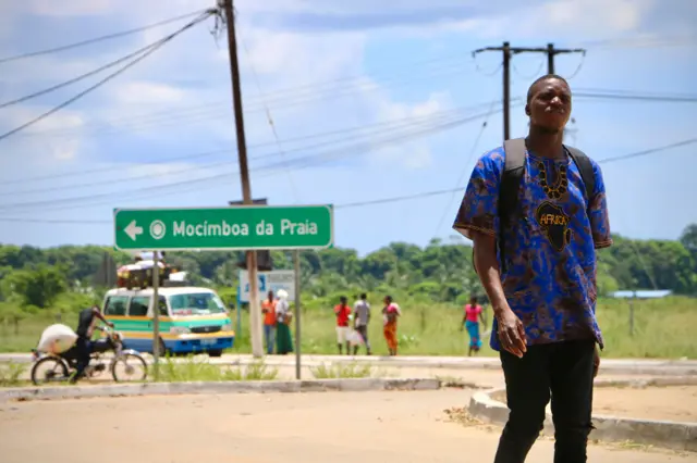 A man walks by the main entrance to the city on March 8, 2018 in Mocimboa da Praia, Mozambique.