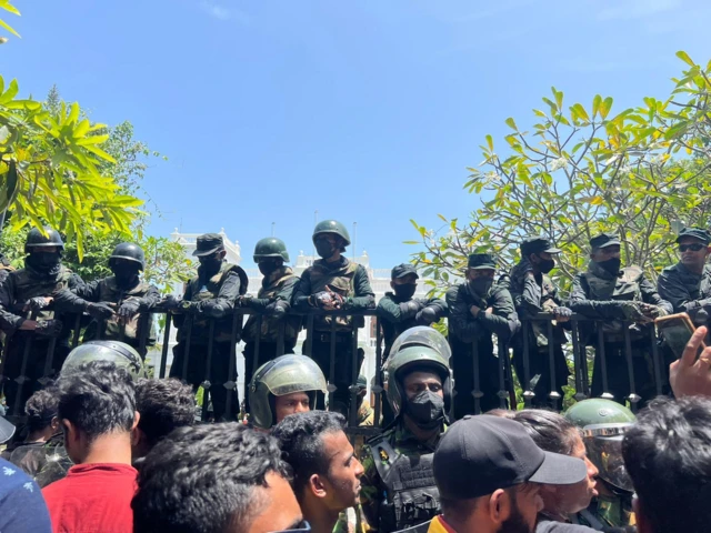 Soldiers stand on fences guarding the Prime Minister's office