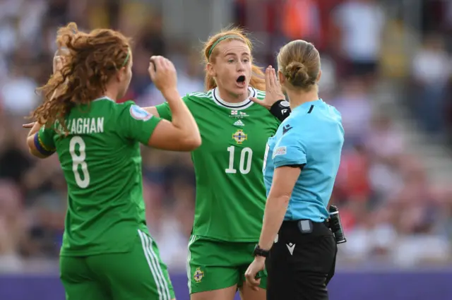 Rachel Furness of Northern Ireland contests a penalty decision to referee