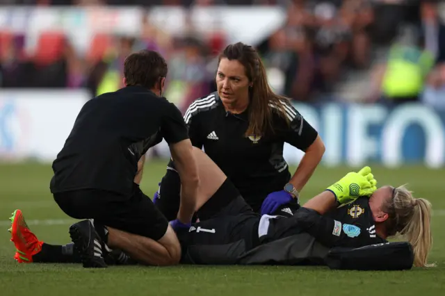 Northern Ireland's goalkeeper Jacqueline Burns receives medical assistance