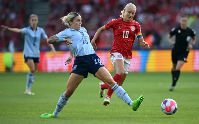 Maria Leon vies with Denmark's striker Pernille Harder during the UEFA Women's Euro 2022 Group B football match between Denmark and Spain at Brentford Community Stadium