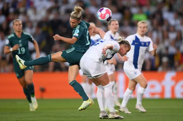 Svenja Huth of Germany battles for possession with Elli Pikkujamsa of Finland