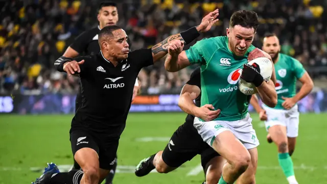 Hugo Keenan fends off Aaron Smith to score Ireland's second try in Wellington