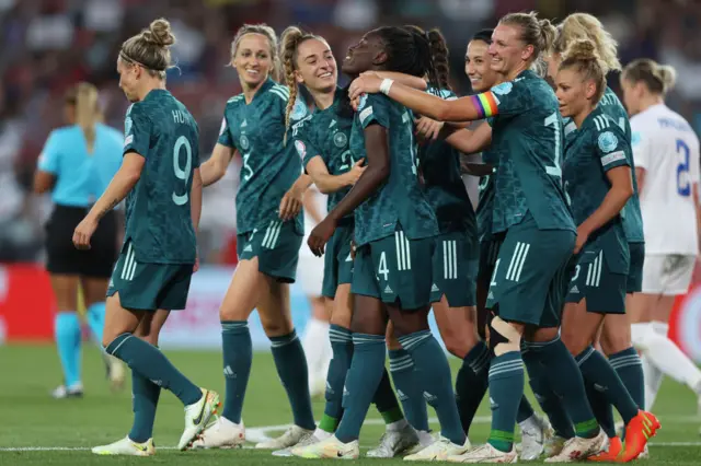 Nicole Anyomi of Germany celebrates their team's third goal with teammates during the UEFA Women's Euro England 2022 group B match between Finland and Germany at Stadium mk