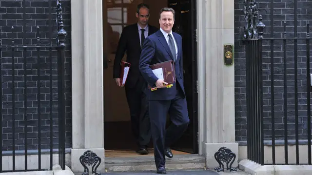 Then prime minister David Cameron leaves 10 Downing Street on Budget Day 2011