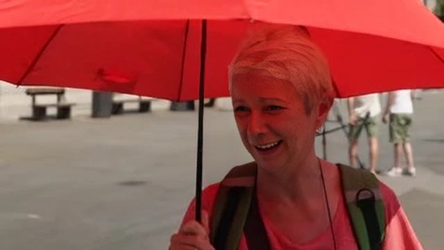 One tourist from Germany brought an umbrella with her "expecting rain".