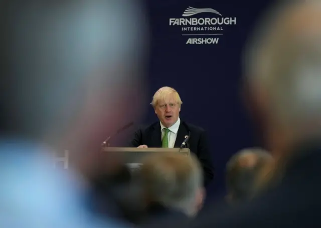 Prime Minister Boris Johnson speaks as he attends the Farnborough International Airshow