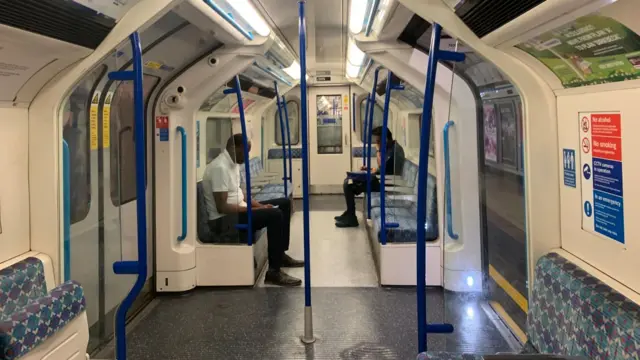 Tube carriage with just two passengers