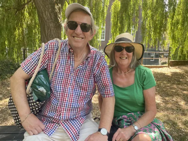 Michael and Jill sat on a bench in Norwich City Centre