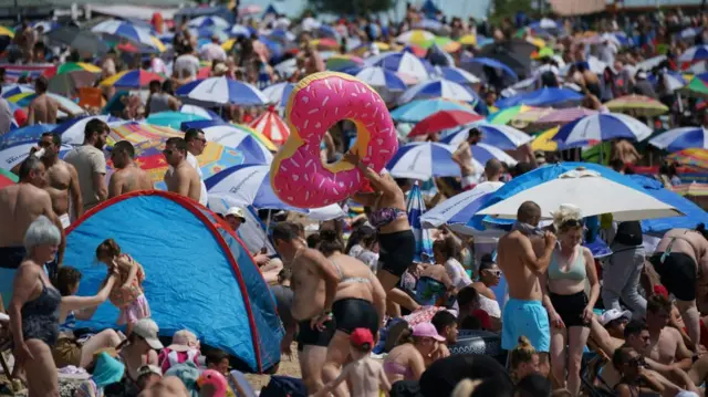 People on the beach at Southend-on-Sea on the Thames Estuary in Essex