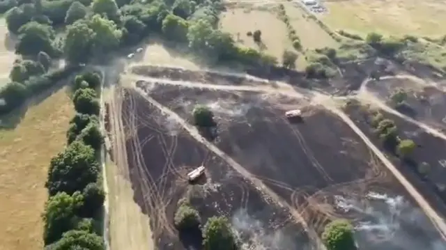 Drone footage of the aftermath of a field fire by Cheshunt Park that started on Monday