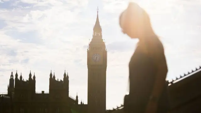 People walk near Westminster Bridge, central London