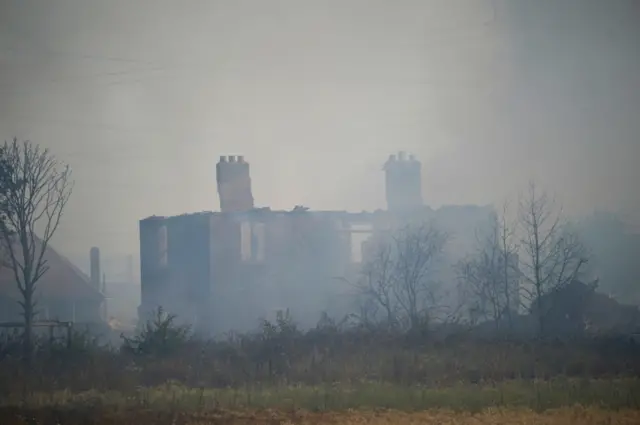 A gutted house after a fire in the village of Wennington, east London