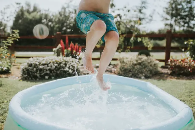 Child in a paddling pool