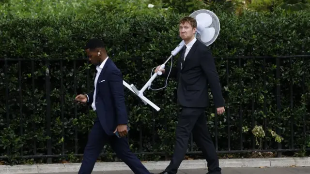 Man carrying a fan