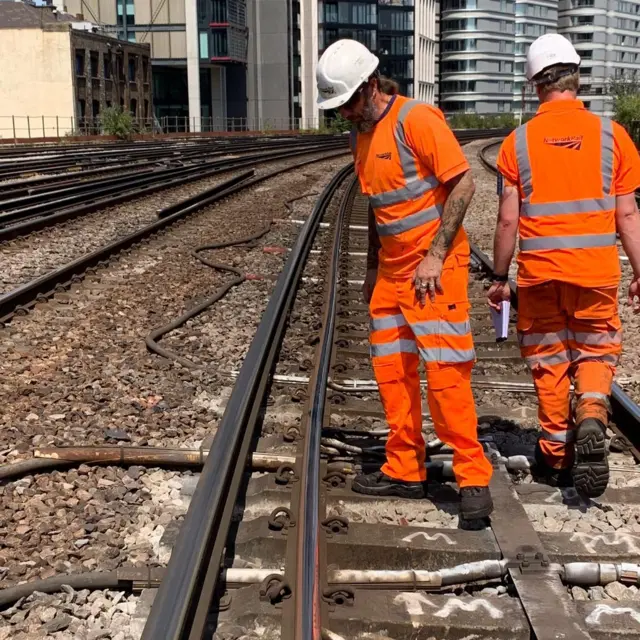 Two men by a rail track