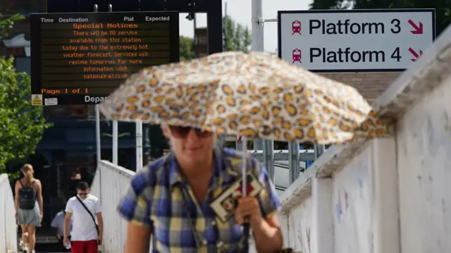 A sign at Alexandra Palace train station in London saying no trains are running due to the hot weather