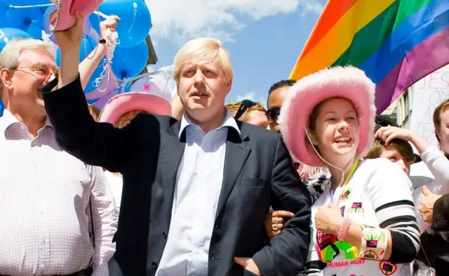 Prime Minister Boris Johnson, then London mayor, at the 2008 Pride march, holding a pink hat