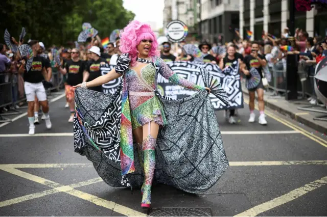 A person takes part in the 2022 Pride Parade in London