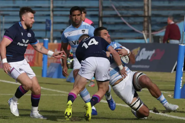 Darcy Graham tackles his man into touch