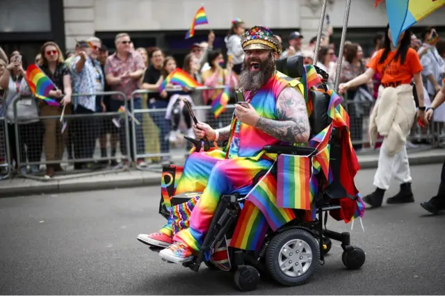 A person takes part in the 2022 Pride Parade in London