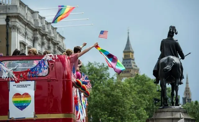 People on a bus celebrating Pride in London 2016