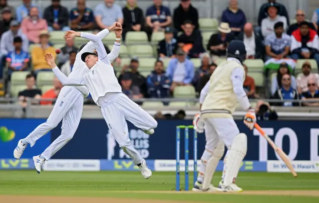 Joe Root and Zak Crawley dive for a catch