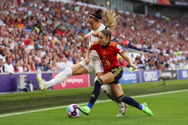Olga Carmona of Spain battles for possession with Lucy Bronze of England during the UEFA Women's Euro 2022 Quarter Final match between England and Spain