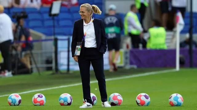 Sarina Wiegman on the pitch at Brighton's Amex Stadium