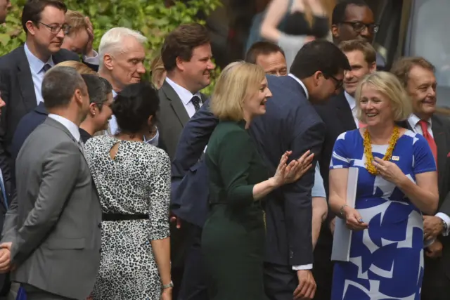 Liz Truss celebrates with some of her backers at Westminster after hearing she'd made the final two in the Tory leadership race