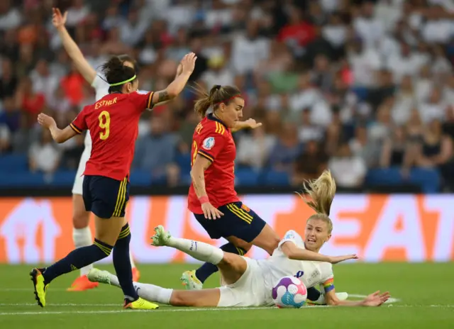 eah Williamson of England is challenged by Patri Guijarro of Spain during the UEFA Women's Euro 2022 Quarter Final match between England and Spain at Brighton & Hove Community Stadium