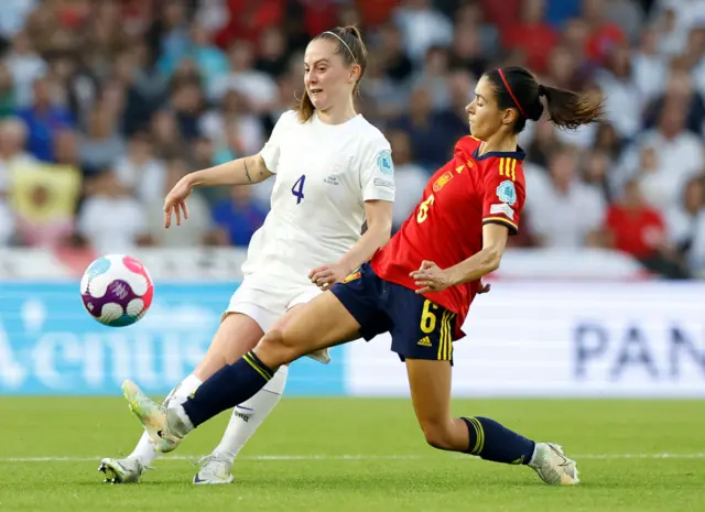 Keira Walsh of England is challenged by Aitana Bonmati of Spain during the UEFA Women's Euro 2022 Quarter Final match between England and Spain at Brighton & Hove Community Stadium