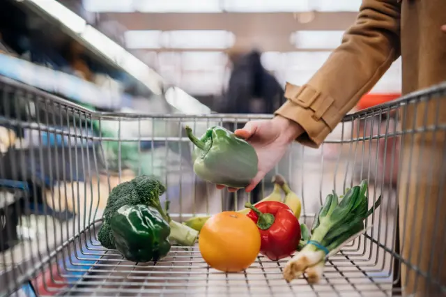 Vegetables are placed in a shopping trolley