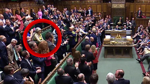 Theres May sitting down as MP's clap Boris Johnson's last PMQs