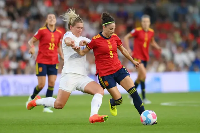 Esther Gonzalez of Spain is challenged by Millie Bright of England during the UEFA Women's Euro 2022 Quarter Final match between England and Spain at Brighton & Hove Community Stadium