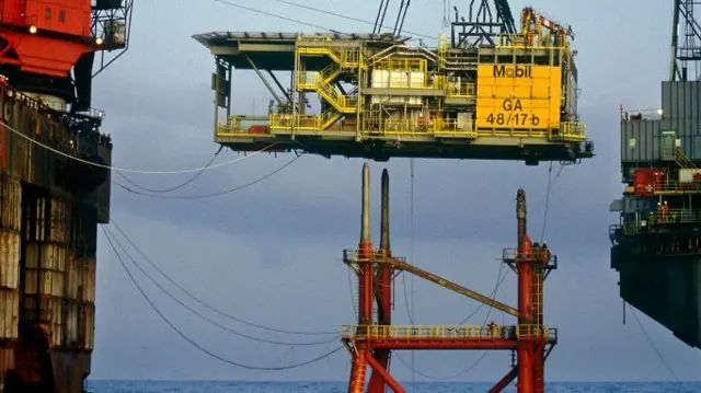 A Mobil gas production platform is installed with a crane barge in the Southern North Sea off Great Yarmouth