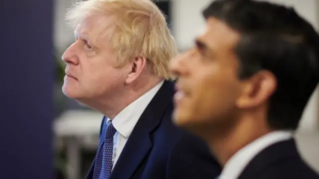 File photo dated 05/10/20 of Prime Minister Boris Johnson and the then Chancellor of the Exchequer Rishi Sunak during a visit to the headquarters of Octopus Energy in London