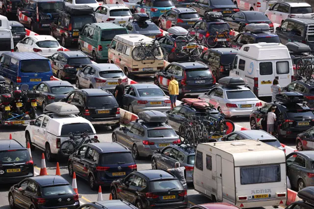 Passengers wait in cars at the border in Dover